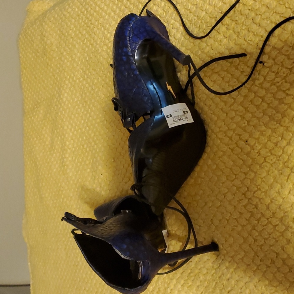 Lust for life black/blue 4 inch heels with lace up and open back. Size 8